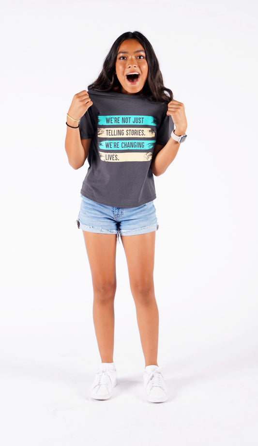 Angelee shows off her two-tone Youth Size Changing Stories t-shirt