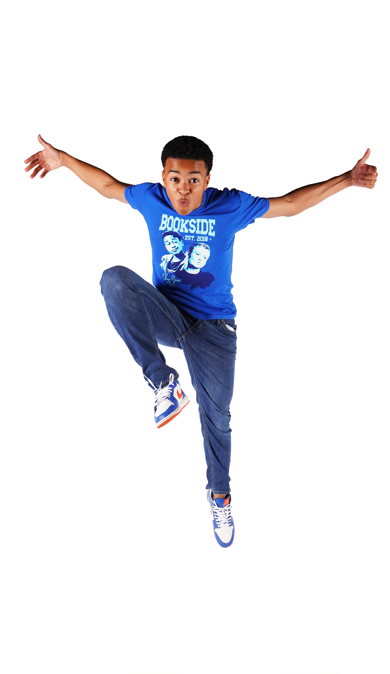 Shaun (Jay) leaps up for joy while wearing the Jay & Mikey Bookside High T-shirt