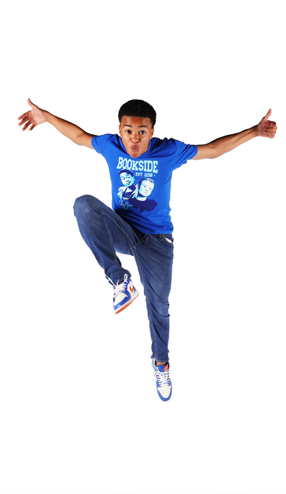Shaun (Jay) leaps up for joy while wearing the Jay & Mikey Bookside High T-shirt