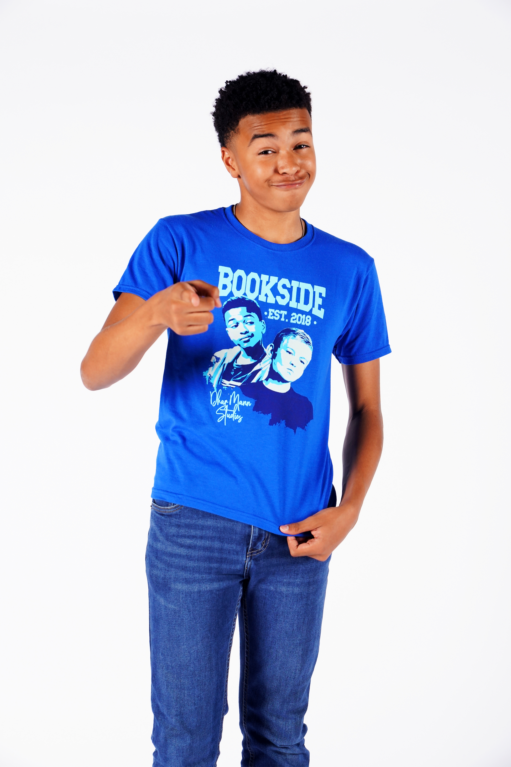 Jay (Shaun Dixon) wears a Jay & Mikey shirt and points to YOU while making a face that says, "Hi, friend!" 