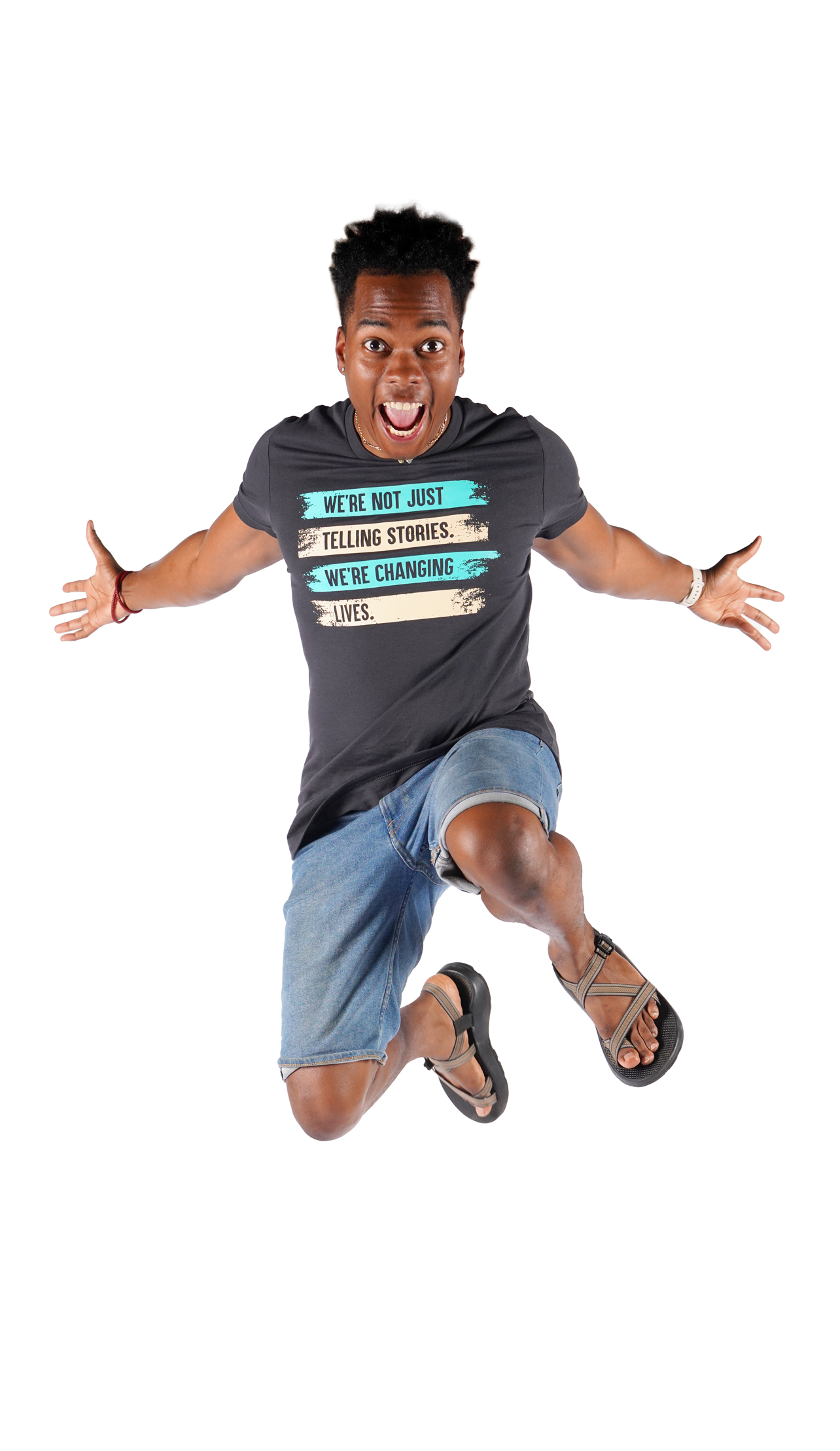 Nick leaps up in excitement, wearing the new two-tone Changing Lives shirt!