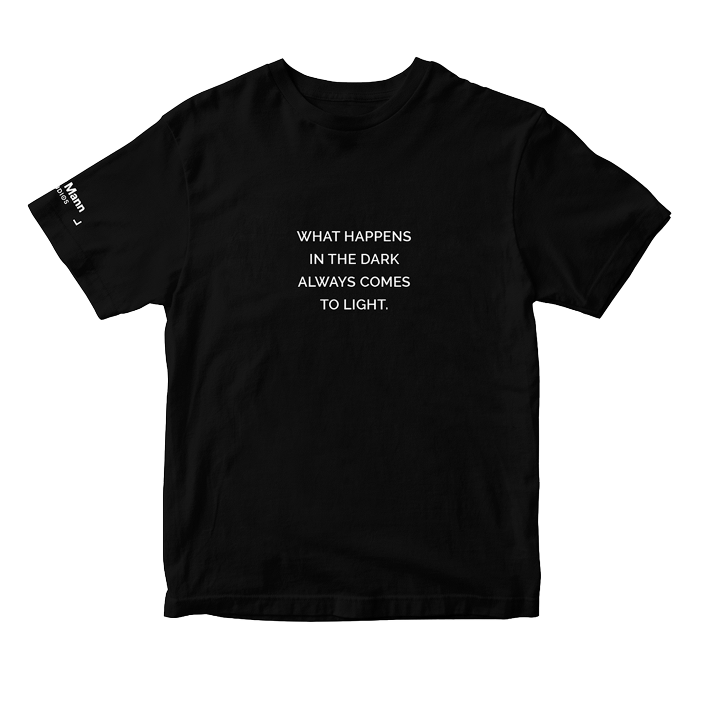 Black short sleeve t-shirt with the text "WHAT HAPPENS IN THE DARK ALWAYS COMES TO LIGHT." printed in white. It also features a printed tag on the right sleeve: the 'Dhar Mann Studios' logo. 
