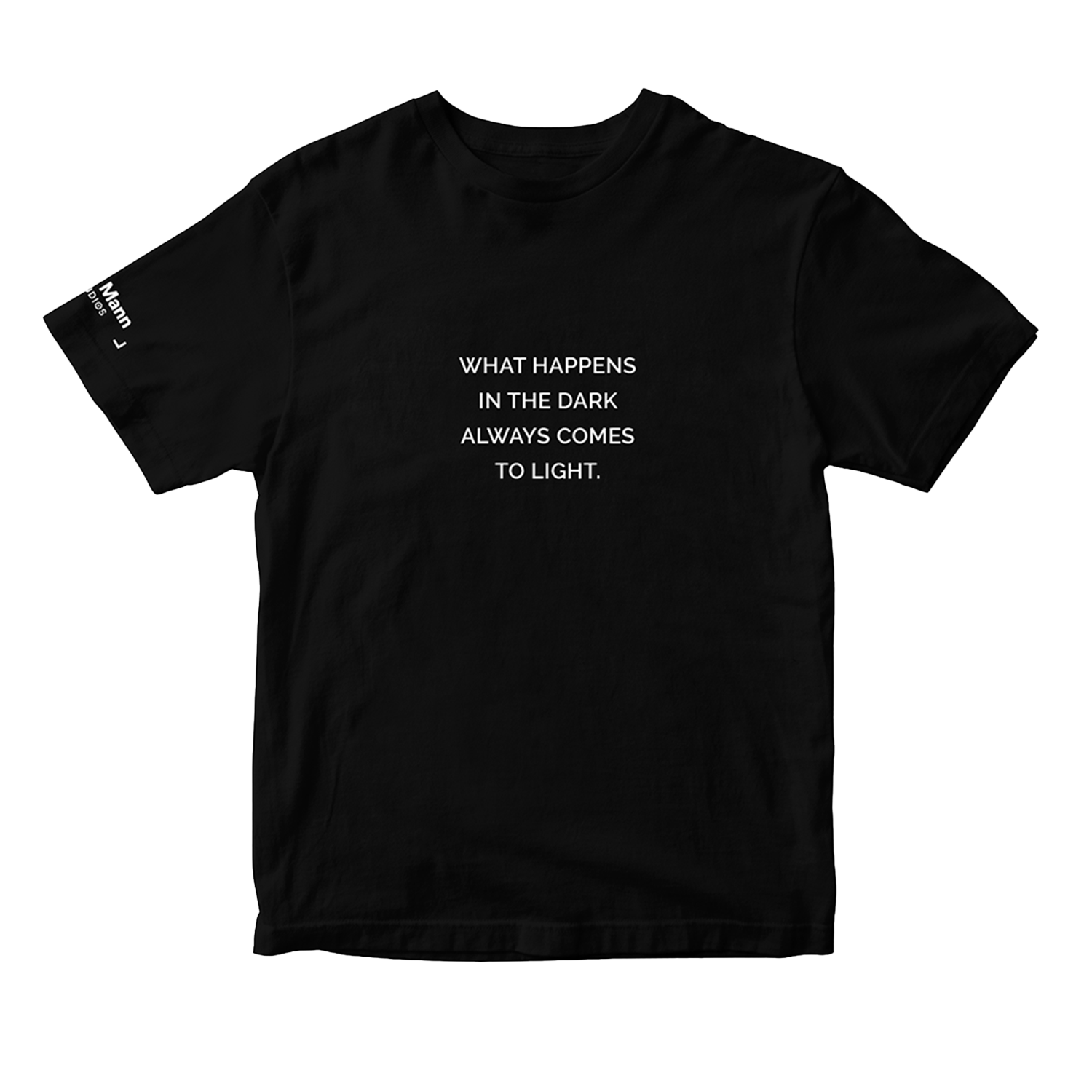 Black short sleeve t-shirt with the text "WHAT HAPPENS IN THE DARK ALWAYS COMES TO LIGHT." printed in white. It also features a printed tag on the right sleeve: the 'Dhar Mann Studios' logo. 